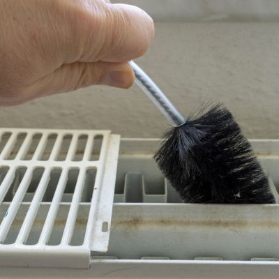 How to Clean Behind a Radiator